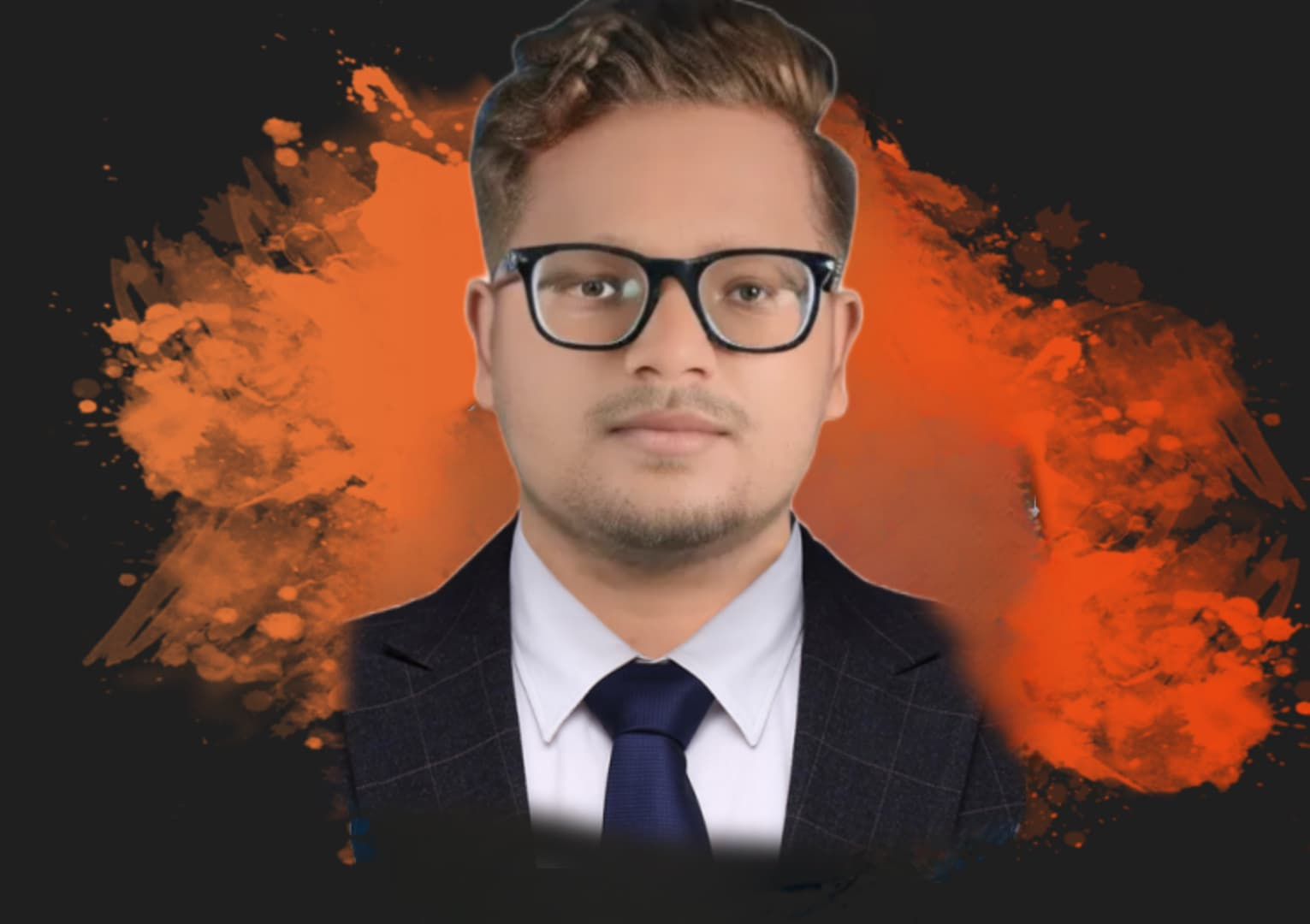 A man in a blue shirt with a happy expression